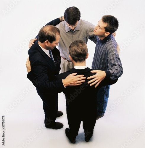 Photo: High Angle View Of Men Praying And Standing In A Circle High Angle View Of Men Praying And Standing In A Circle