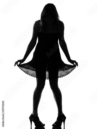 Photo: stylish silhouette woman showing her legs stylish silhouette woman showing her legs