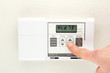 Hand on Thermostat