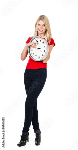 Photo: Blonde beautiful girl with the clock Blonde beautiful girl with the clock