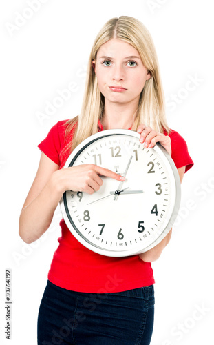 Photo: Cute blonde girl with the clock Cute blonde girl with the clock