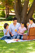 Lovely family picnicking in the park Lovely family picnicking in the park