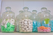 Photo: glass jar with colored pills glass jar with colored pills