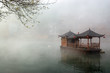 China landscape of boat on foggy river China landscape of boat on foggy river