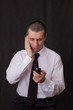 young businessman talking on two phones young businessman talking on two phones