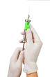 Syringe with a medicine in a hand, isolated on white
