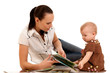 laughing baby playing with mother
