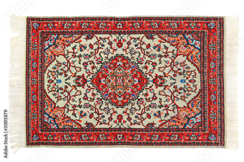 Photo: Rectangular bright carpet horizontally lies on white background Rectangular bright carpet horizontally lies on white background