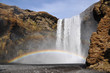 Skogafoss waterfall with rainbow south Iceland