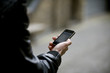 A young man looking at a map on his mobile phone