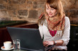Morning coffee in internet cafe - Beautiful young girl checking Morning coffee in internet cafe - Beautiful young girl checking