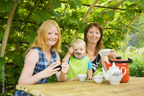 Photo: mother with children having tea mother with children having tea