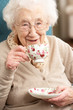 Senior Woman Enjoying Cup Of Tea At Home