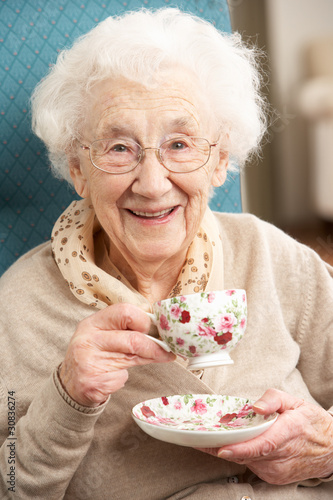 Photo: Senior Woman Enjoying Cup Of Tea At Home Senior Woman Enjoying Cup Of Tea At Home