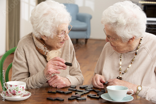 Photo: Two Senior Women Playing Dominoes At Day Care Centre Two Senior Women Playing Dominoes At Day Care Centre
