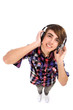 Photo : Young man listening to headphones Young man listening to headphones