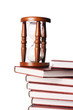 Hourglasses and book isolated on white background