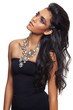 beautiful woman with long curly hair and flower necklace.