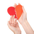 Stitched broken heart in woman's hands