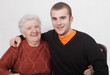 Senior woman and grandson laughing and hugging Senior woman and grandson laughing and hugging