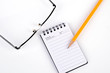 Glasses and pencil with notepad Glasses and pencil with notepad