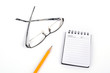 Glasses and pencil with notepad Glasses and pencil with notepad