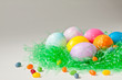 Brightly decorated easter eggs and jelly beans Brightly decorated easter eggs and jelly beans