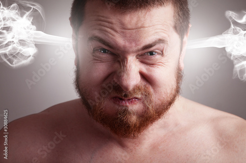 Photo: Stress concept - angry man with exploding head Stress concept - angry man with exploding head