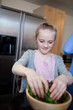 Girl preparing healthy meal in kitchen