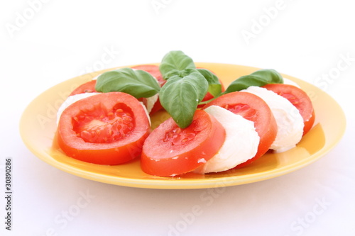 Photo: Caprese salad - tomatoes, mozzarella and basil Caprese salad - tomatoes, mozzarella and basil
