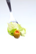fork witn an olive isolated on white