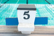 Track, swimming pool, number five. Track, swimming pool, number five.