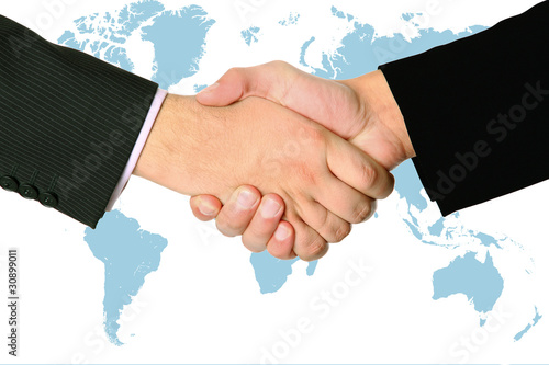 Photo: handshake of two businessmans agreement handshake of two businessmans agreement