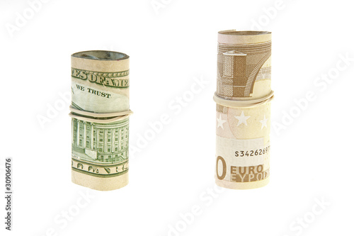Photo: rolls of euro and dollar on a white background rolls of euro and dollar on a white background