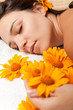 Woman getting a hot stone massage at spa salon