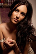 Portrait of beautiful young brunette woman with long curly hair