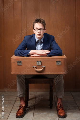 Photo: Serious Man With Suitcase Serious Man With Suitcase