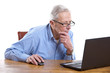 Foto: Senior man behind the computer Senior man behind the computer
