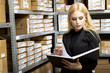Sexy young woman doing inventory