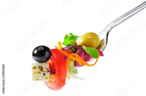 Photo: Vegetable salad with cheese and olives isolated Vegetable salad with cheese and olives isolated