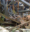 collapsed roof showing wood glass,and stone rubble collapsed roof showing wood glass,and stone rubble