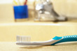 closeup of a toothbrush at the bathroom sink