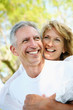 Mature couple smiling and embracing