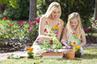 Woman and Girl, Mother & Daughter, Gardening Planting Flowers