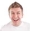 Happy young man is surprised and smiling widely