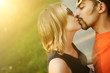 Couple in love kissing outdoors. Copyspace.