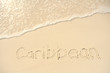 Photo: Caribbean Written in Sand on Beach Caribbean Written in Sand on Beach