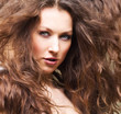 Beautiful young girl with long curly hair