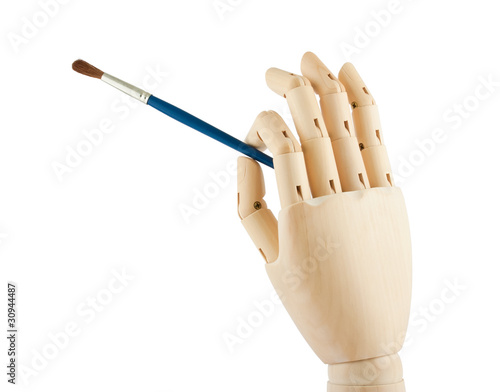 Photo: Wooden hand and brush Wooden hand and brush
