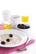 Oatmeal with honey and blackberries isolated on white background